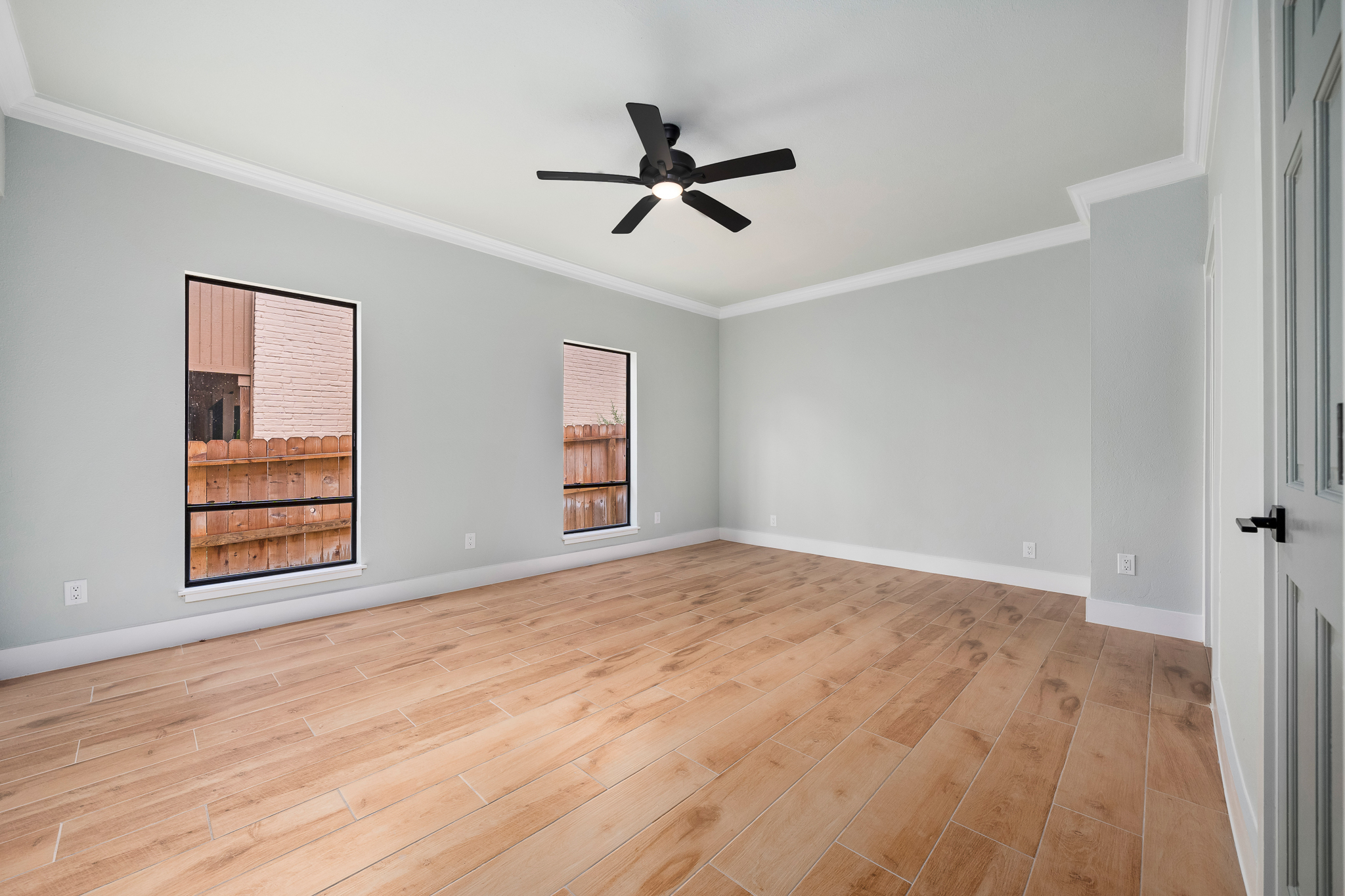 vacant primary bedroom of a waterfront property before virtual staging