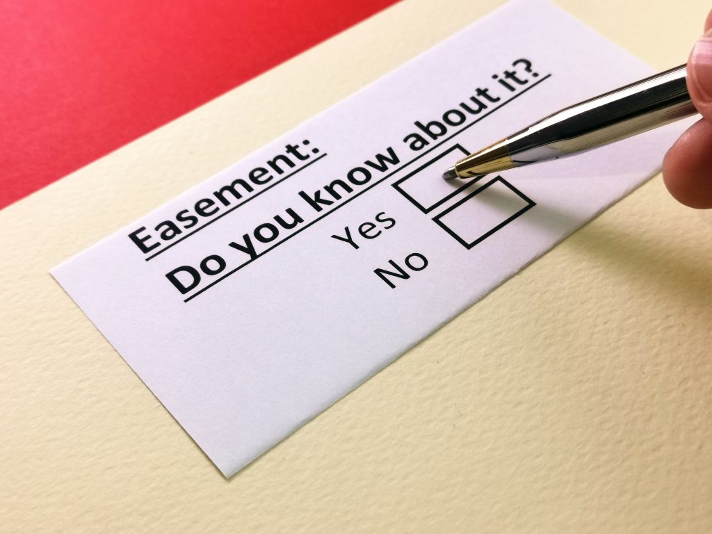One person is answering a questionnaire: what do you know about easements in real estate