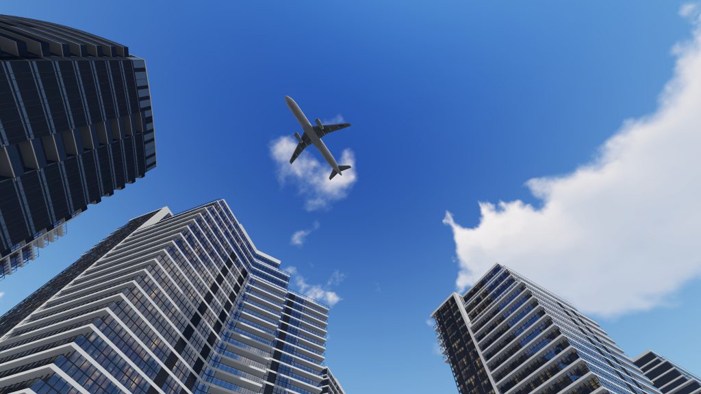 image of a plane flying over commercial buildings to demonstrate property air rights