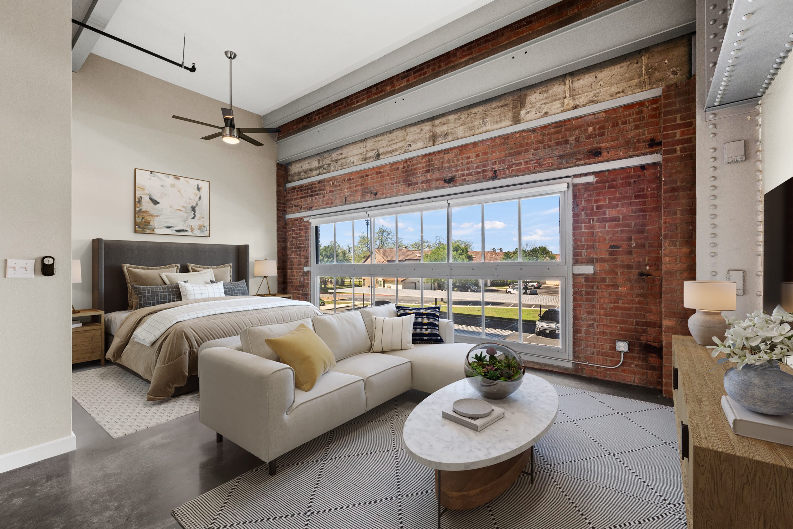 Vacant loft apartment; after virtual apartment staging with bedroom and living room setup