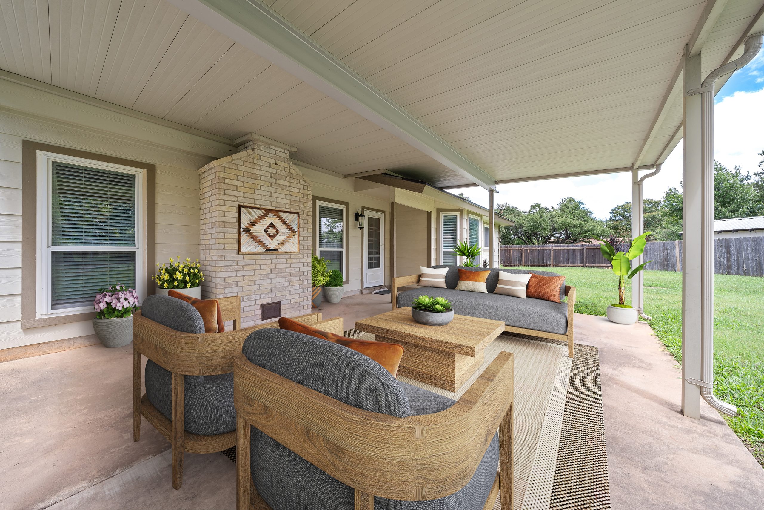 Square Foot Productions, Virtual Staging after image depicting an outdoor patio with lounge furniture, a fireplace, and twilight edit to help build trust with clients