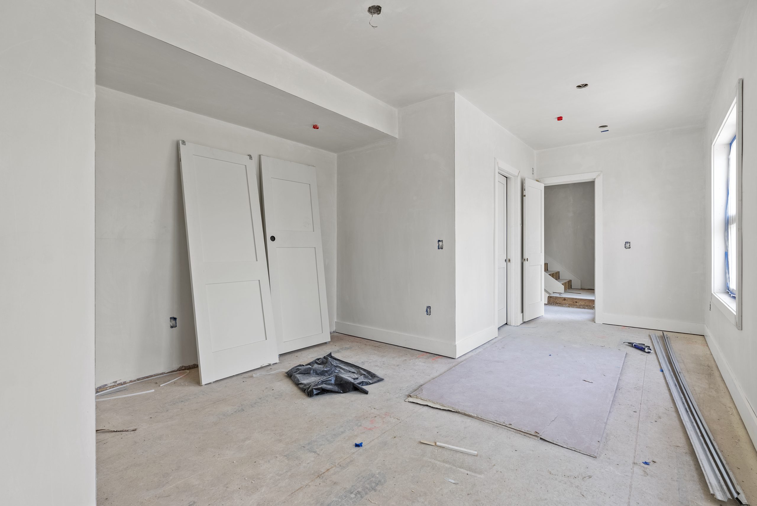 secondary bedroom, unfinished flooring and finishes; before virtual remodel